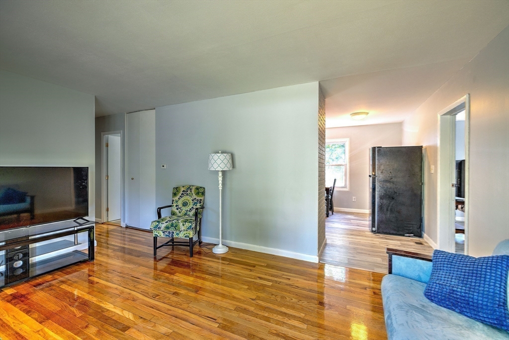 25 Tahanto Road Worcester, MA 01602 - Photo 24 of 35 a living room with furniture and a flat screen tv