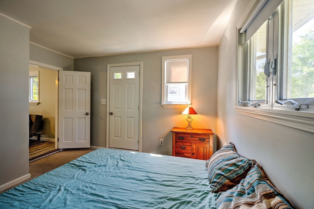 25 Tahanto Road Worcester, MA 01602 - Photo 32 of 35 a bedroom with a bed and wooden floor
