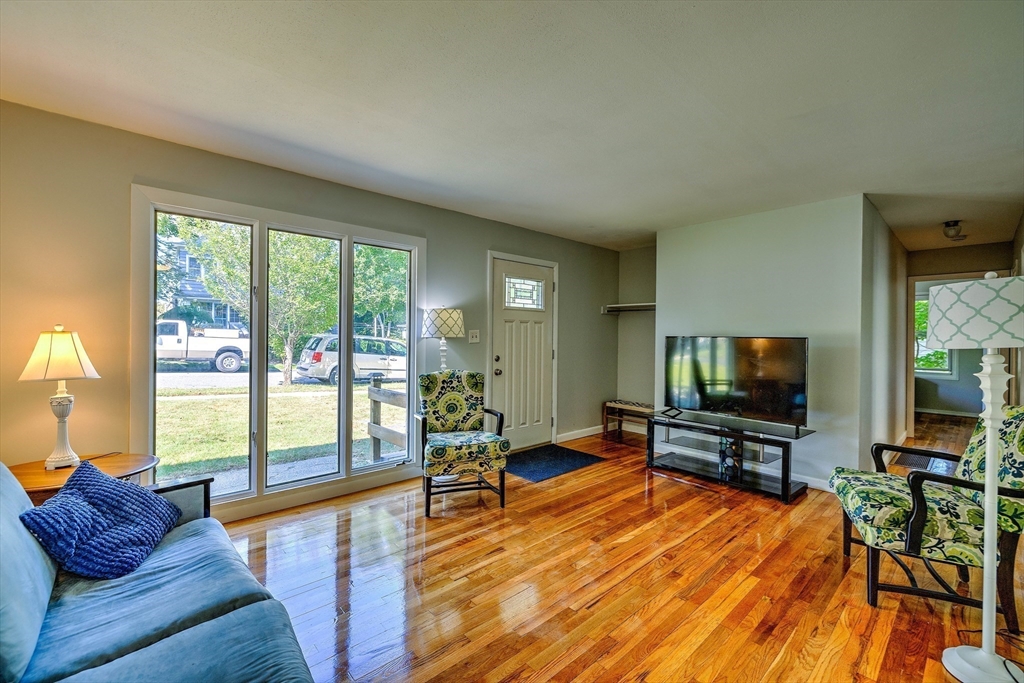 25 Tahanto Road Worcester, MA 01602 - Photo 7 of 35 a living room with furniture and a flat screen tv