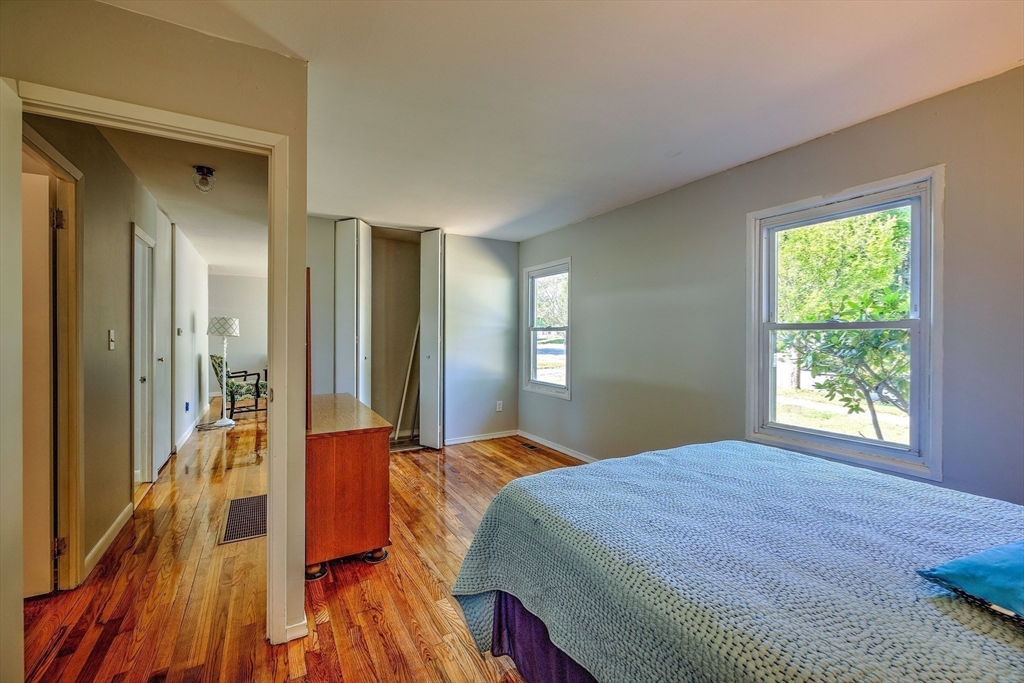 25 Tahanto Road Worcester, MA 01602 - Photo 10 of 35 a bedroom with a bed and a wooden floor