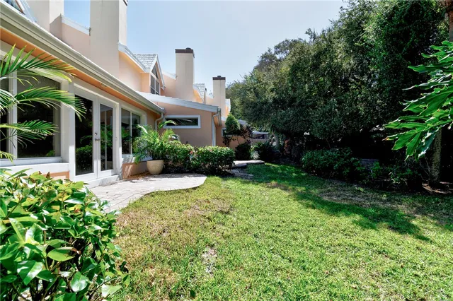 a view of a house with sitting area and garden
