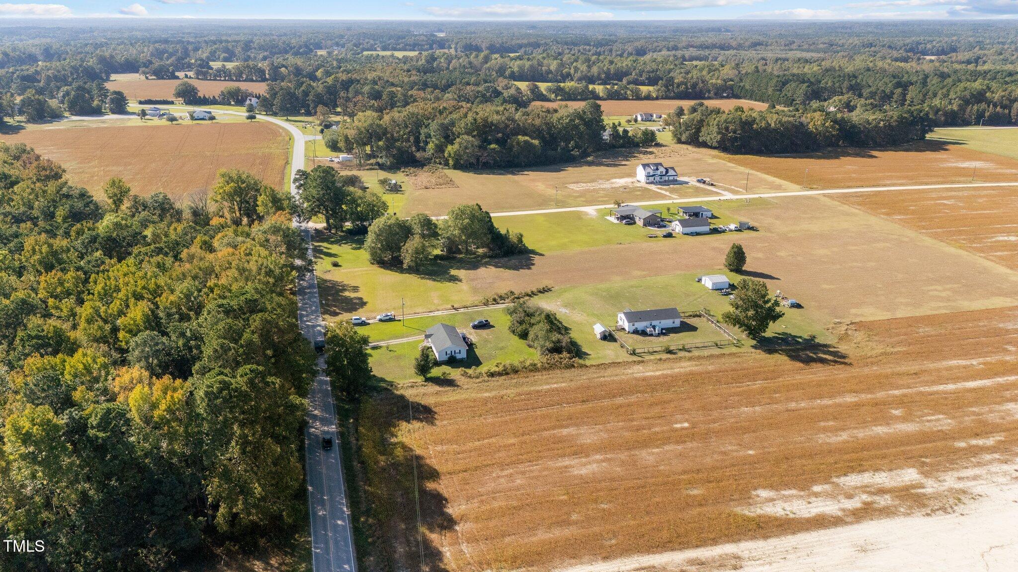650 Short Journey Road Smithfield, NC 27577 - Photo 7 of 14 an aerial view of a house with yard ocean and mountain view in back