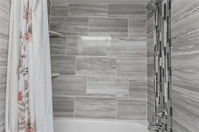 a view of an swimming pool with an outdoor space and seating area