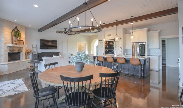 an aerial view of a residential houses with city view