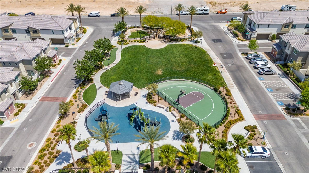 12367 Indigo Montage Road, Unit 3 Las Vegas, NV 89183 - Photo 30 of 33 An aerial view showcases a vibrant community park with recreational amenities and surrounding residences.