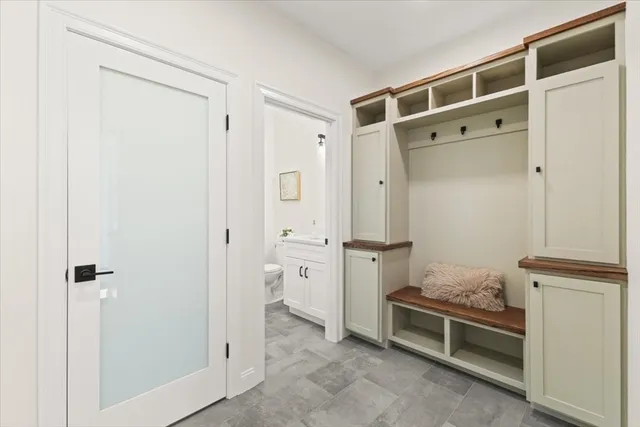 a bathroom with a shower and a sink