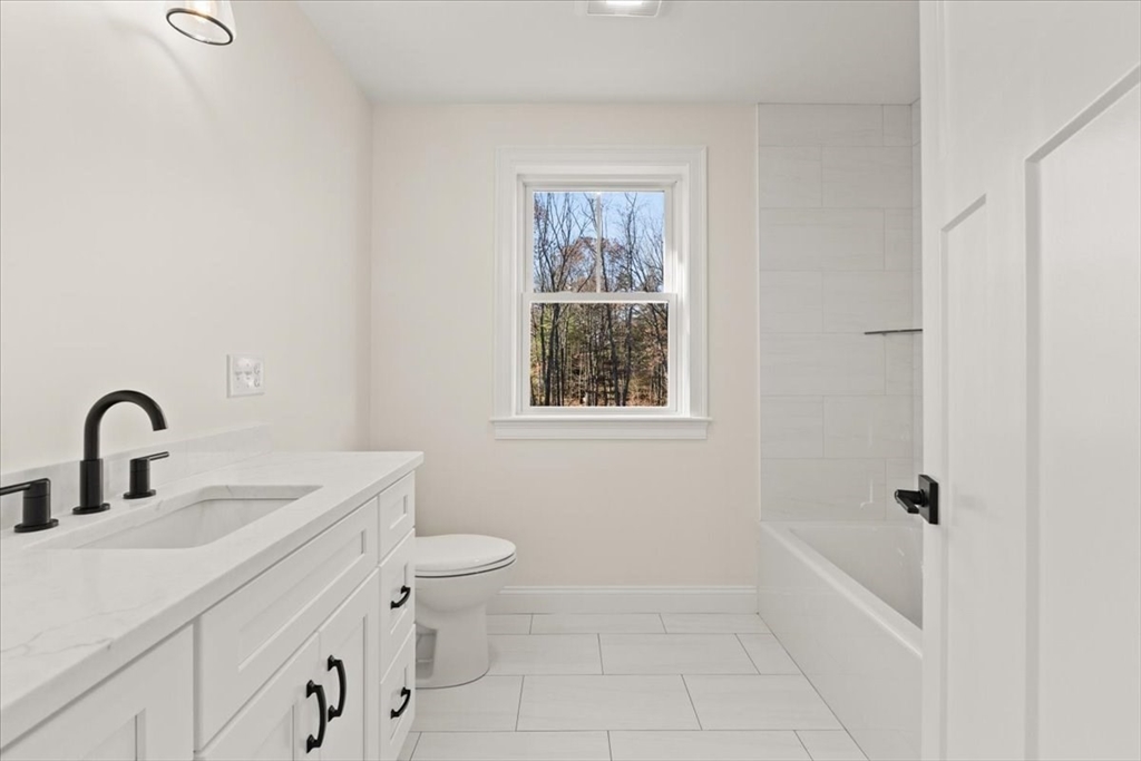 Lot 10 Matthew Circle Easton, MA 02356 - Photo 19 of 33 a bathroom with a toilet sink and window