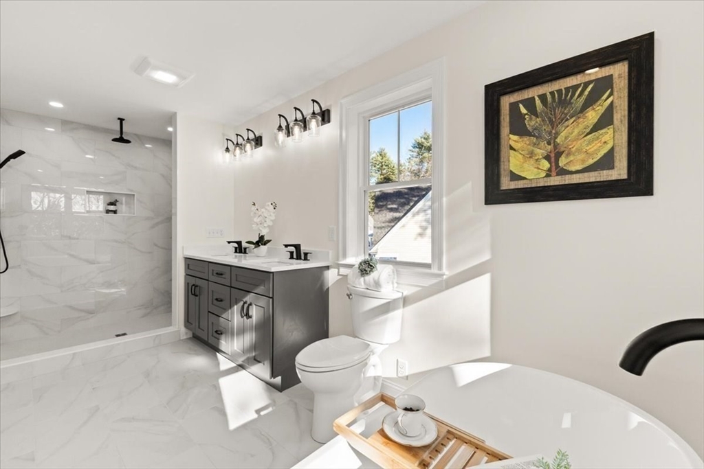 Lot 10 Matthew Circle Easton, MA 02356 - Photo 27 of 33 a bathroom with a sink mirror vanity and toilet