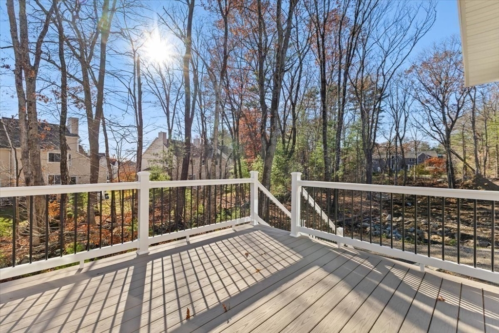 Lot 10 Matthew Circle Easton, MA 02356 - Photo 31 of 33 a view of balcony with wooden floor and fence
