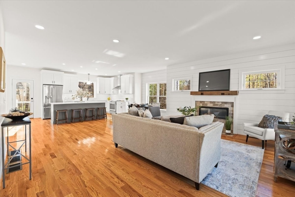 Lot 10 Matthew Circle Easton, MA 02356 - Photo 4 of 33 a living room with furniture and a flat screen tv
