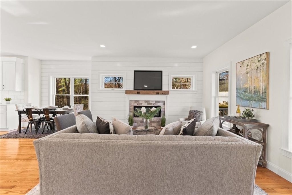 Lot 10 Matthew Circle Easton, MA 02356 - Photo 5 of 33 a living room with fireplace furniture and a flat screen tv