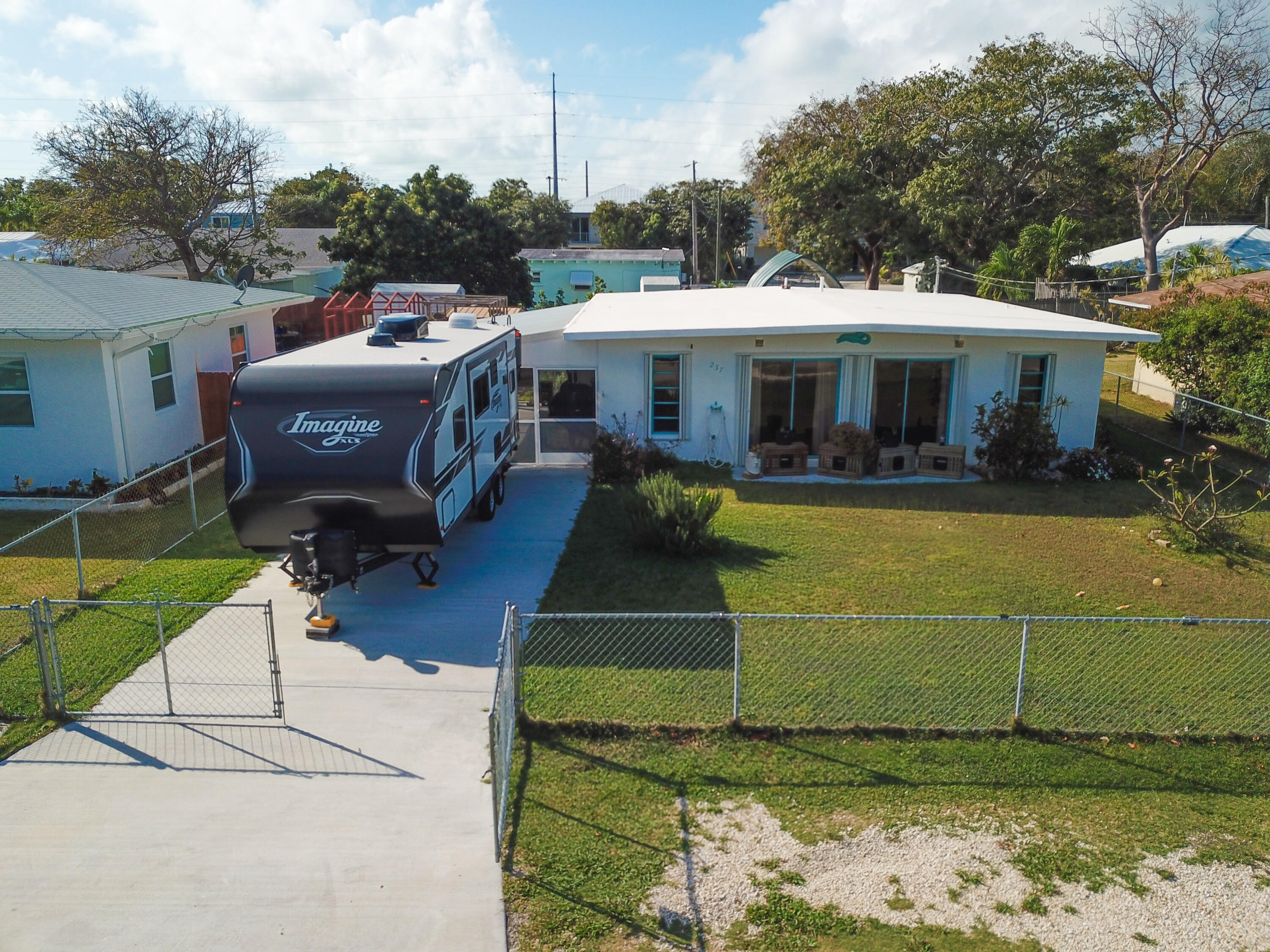 237 2nd Road Key Largo, FL 33037 - Photo 1 of 25 a view of a house with a yard