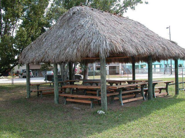 237 2nd Road Key Largo, FL 33037 - Photo 23 of 25 a view of a chairs and table under an umbrella in backyard