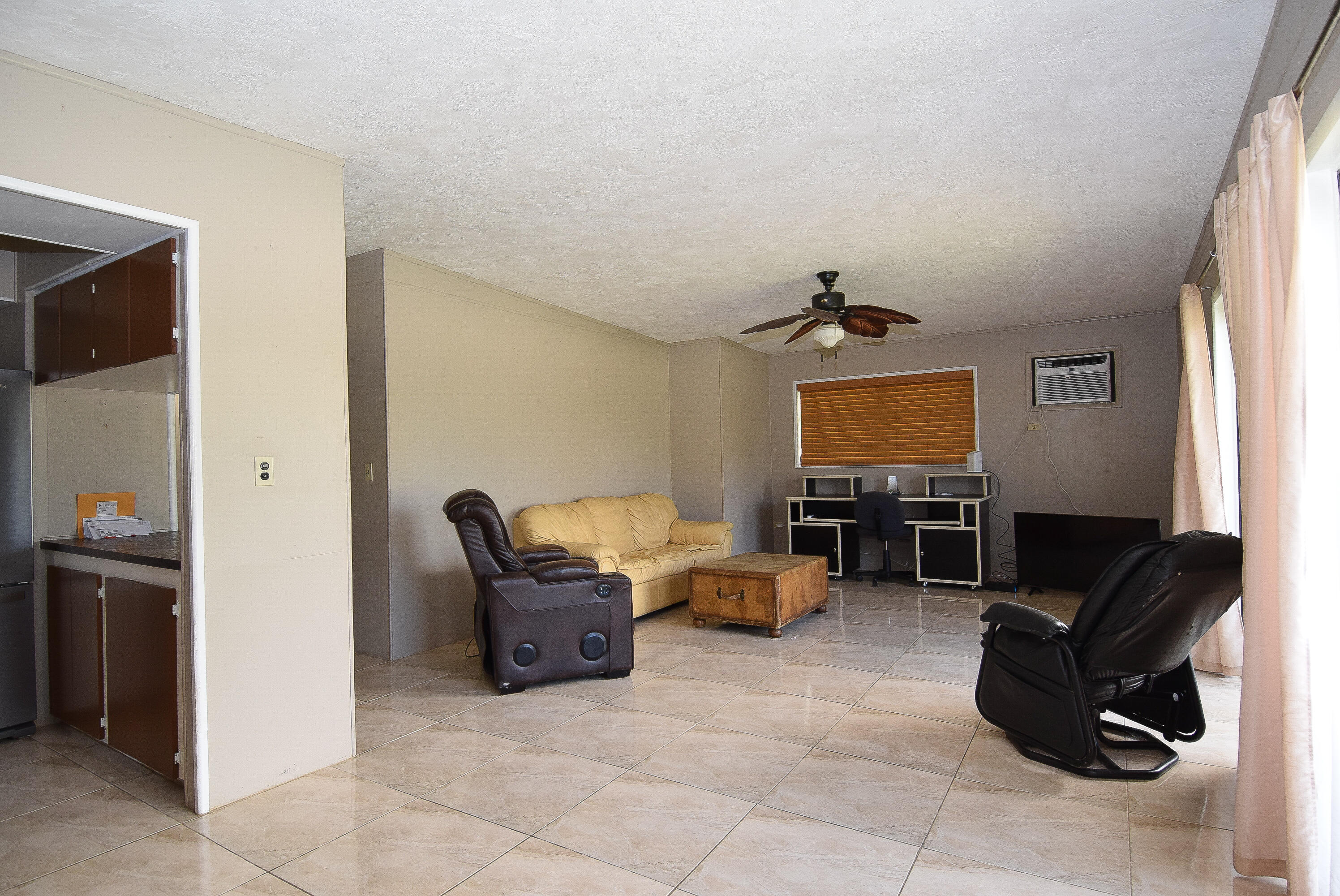 237 2nd Road Key Largo, FL 33037 - Photo 6 of 25 a living room with furniture and a flat screen tv