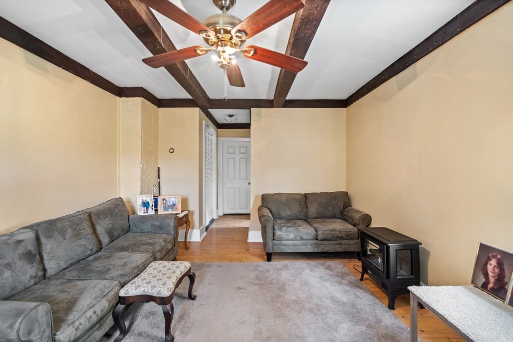 44 Stockbridge Road Scituate, MA 02066 - Photo 12 of 24 a living room with furniture and a flat screen tv