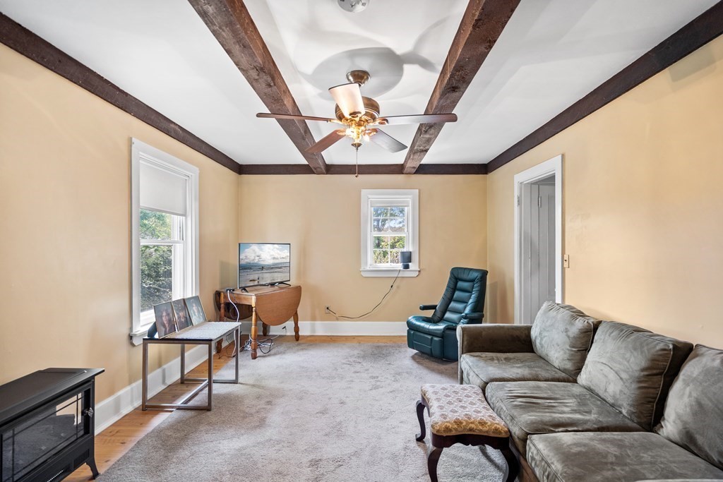 44 Stockbridge Road Scituate, MA 02066 - Photo 14 of 24 a living room with furniture and a chandelier