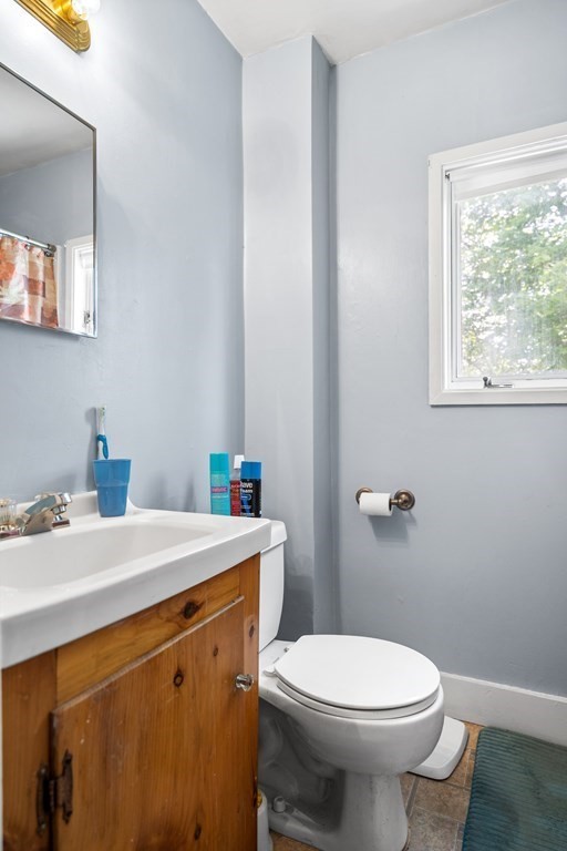 44 Stockbridge Road Scituate, MA 02066 - Photo 16 of 24 a bathroom with a sink a toilet and a mirror