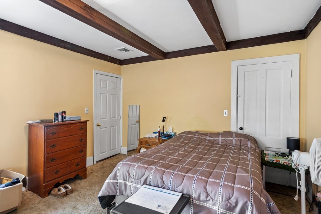 44 Stockbridge Road Scituate, MA 02066 - Photo 18 of 24 a bedroom with a bed and a dresser