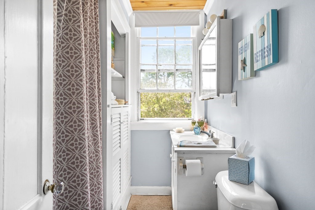 44 Stockbridge Road Scituate, MA 02066 - Photo 8 of 24 a bathroom with a sink toilet and window