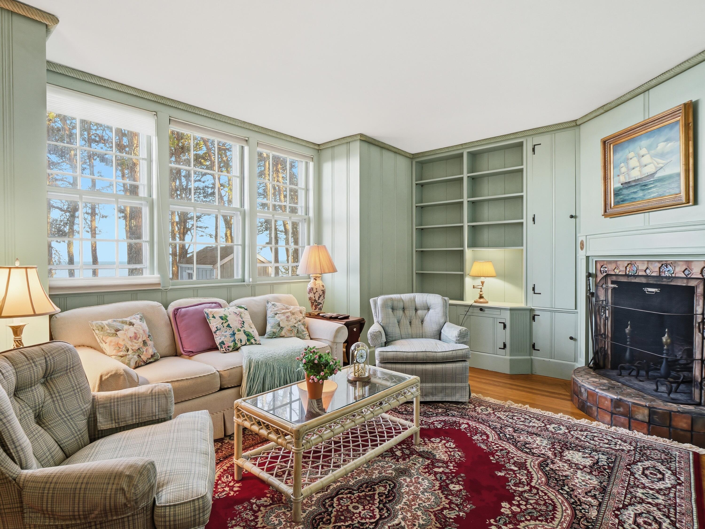 190 Vineyard Road Cotuit, MA 02635 - Photo 21 of 41 a living room with furniture and a fireplace