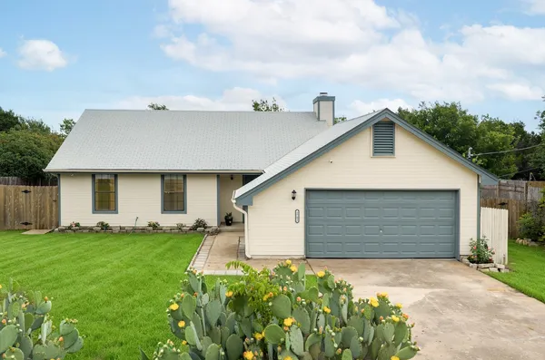 a view of a backyard of the house