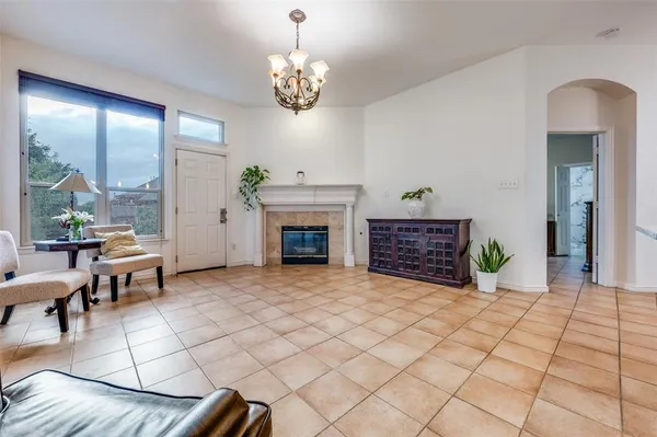 a view of a livingroom with furniture and a chandelier