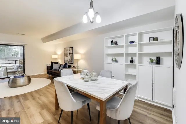 a view of a dining room with furniture window and wooden floor