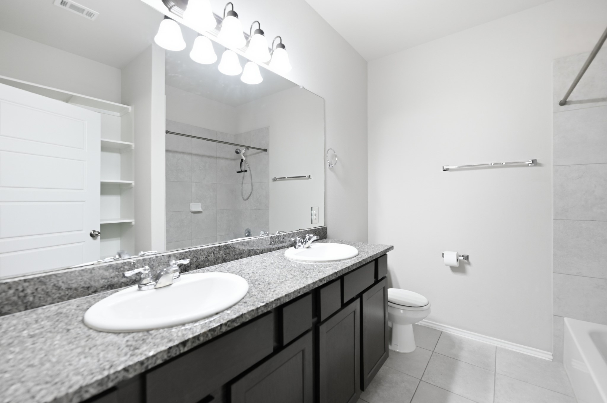 1733 Davidson Ranch Road Georgetown, TX 78626 - Photo 18 of 33 Polished granite counters and double sinks anchor this clean, modern bathroom space.