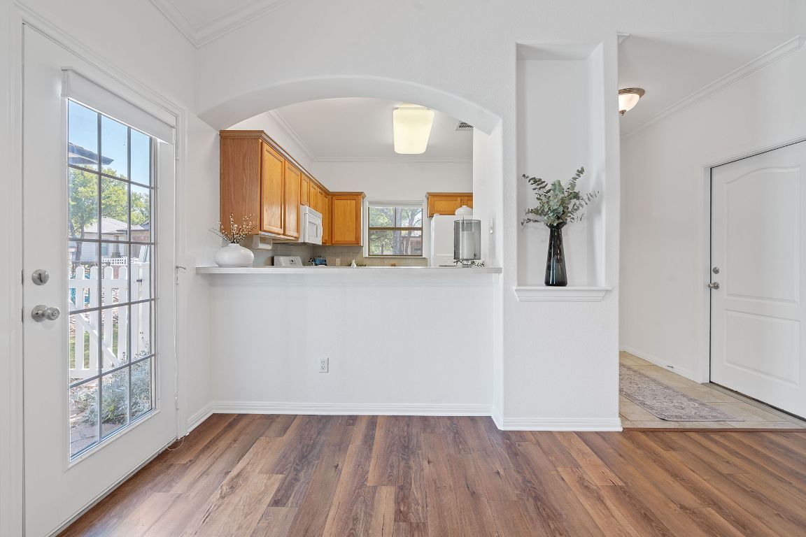 6801 Beckett Road, Unit 119R Austin, TX 78749 - Photo 11 of 26 wooden floor in an empty room with a window
