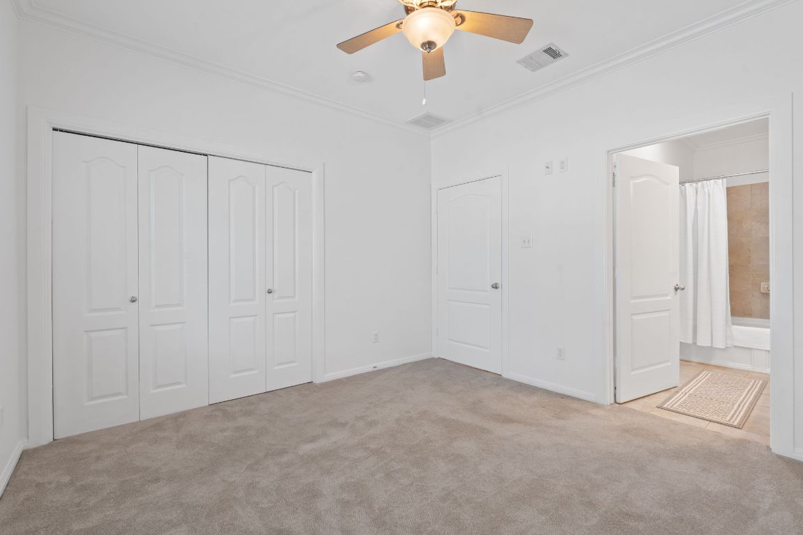 6801 Beckett Road, Unit 119R Austin, TX 78749 - Photo 14 of 26 an empty room with chandelier fan