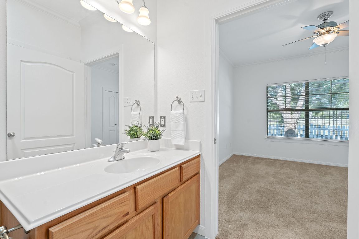 6801 Beckett Road, Unit 119R Austin, TX 78749 - Photo 16 of 26 a bathroom with a sink a vanity and a mirror