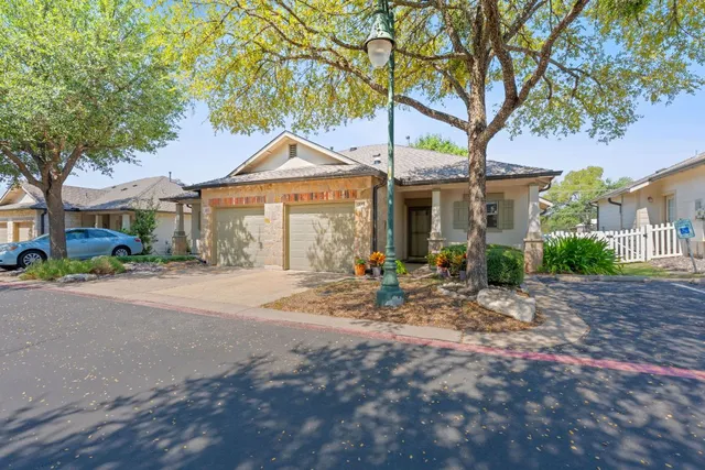 a front view of a house with porch and outdoor seating