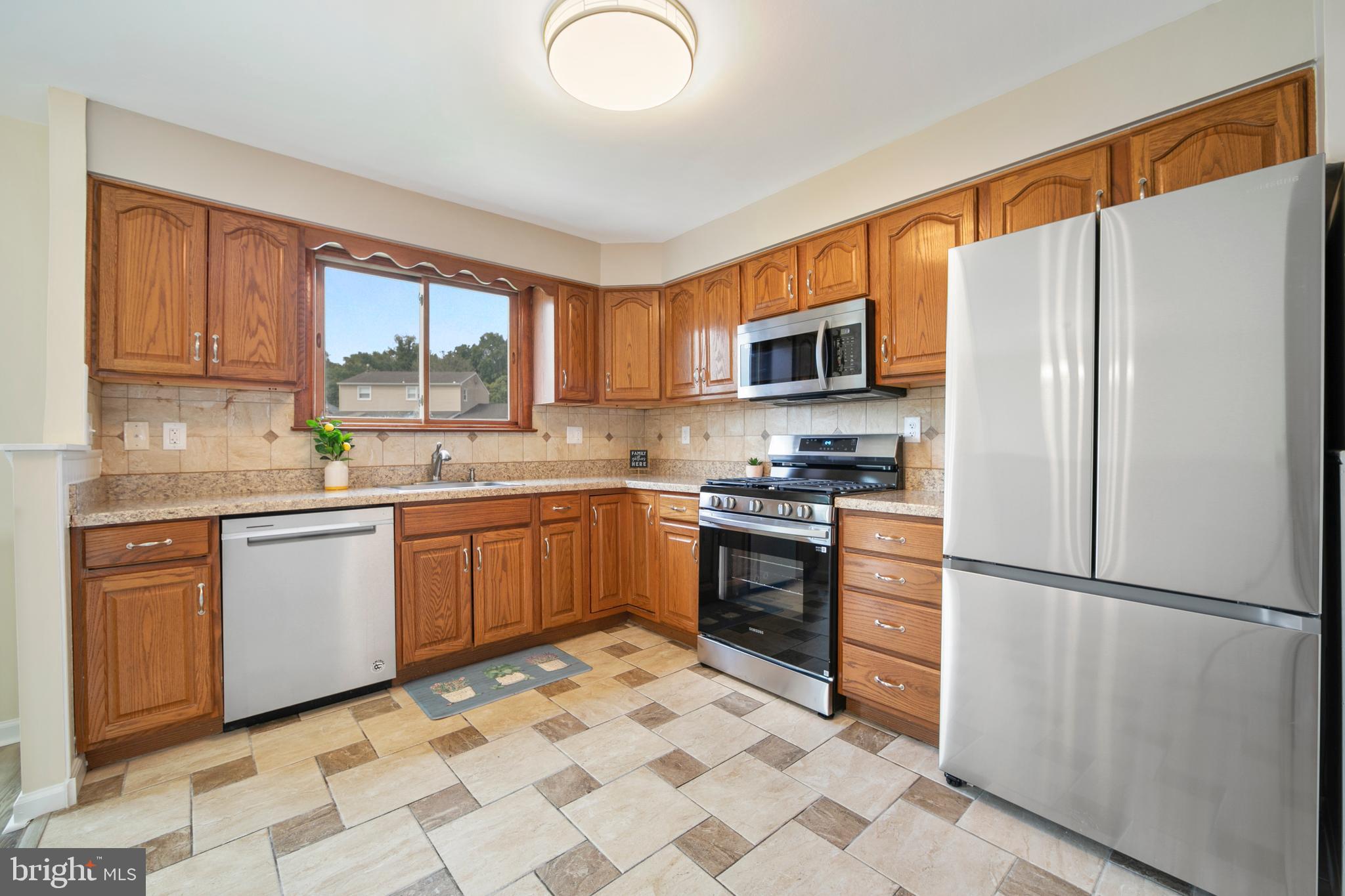 95 Lincoln Drive Clementon, NJ 08021 - Photo 18 of 47 a kitchen with stainless steel appliances granite countertop a refrigerator stove top oven and sink