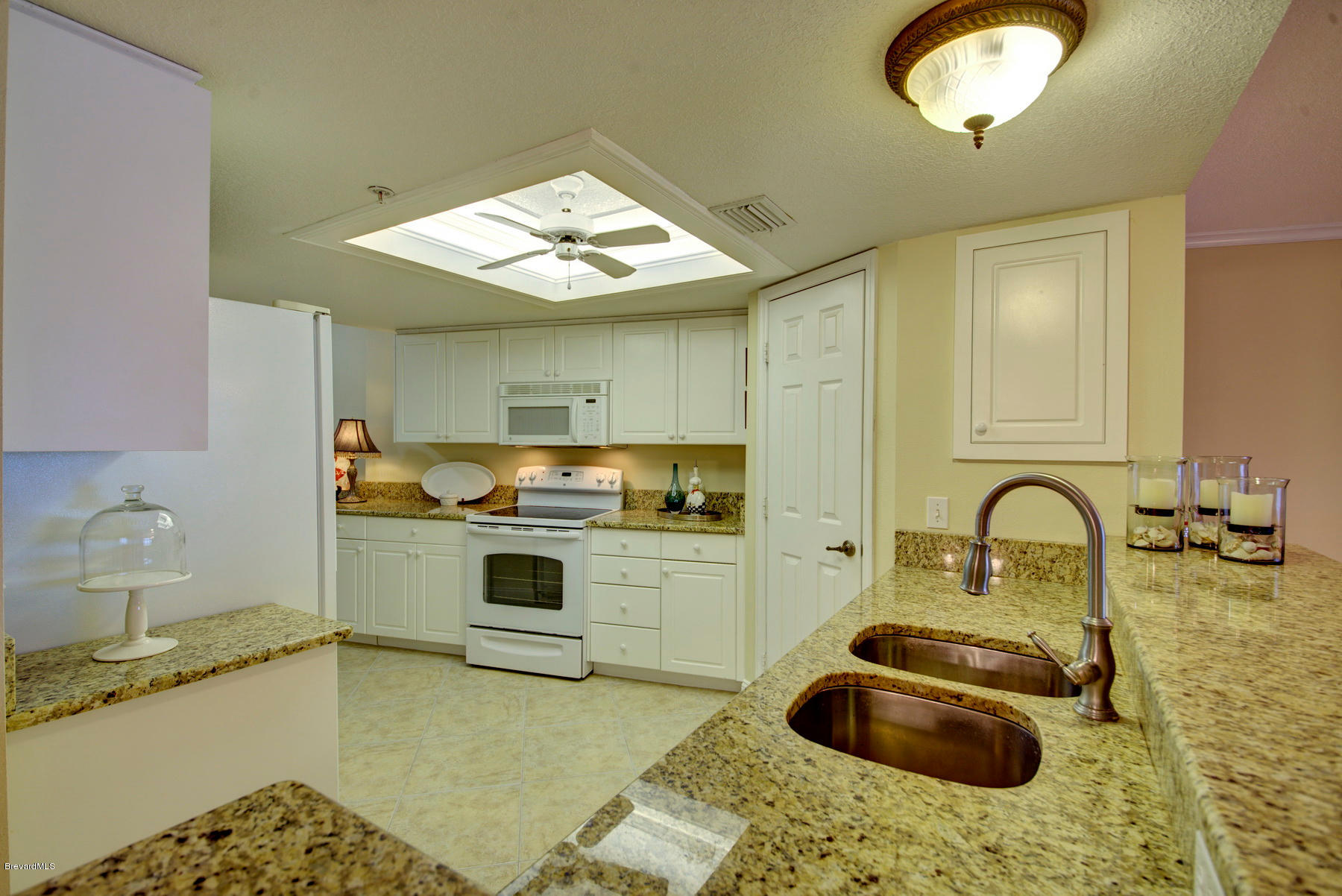 104 Riverside Drive, Unit 204 Cocoa, FL 32922 - Photo 15 of 27 Ceiling_Fan_in_Kitchen