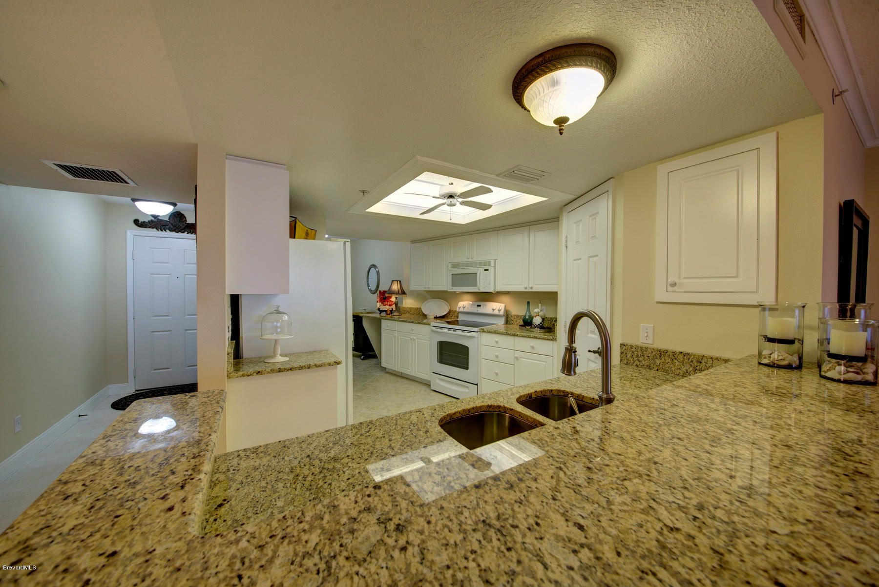 104 Riverside Drive, Unit 204 Cocoa, FL 32922 - Photo 16 of 27 Kitchen_with_Granite_Countertops(1)