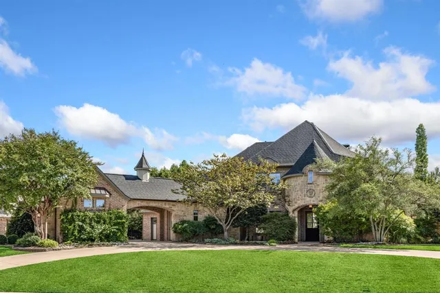 a view of house with garden space and street view
