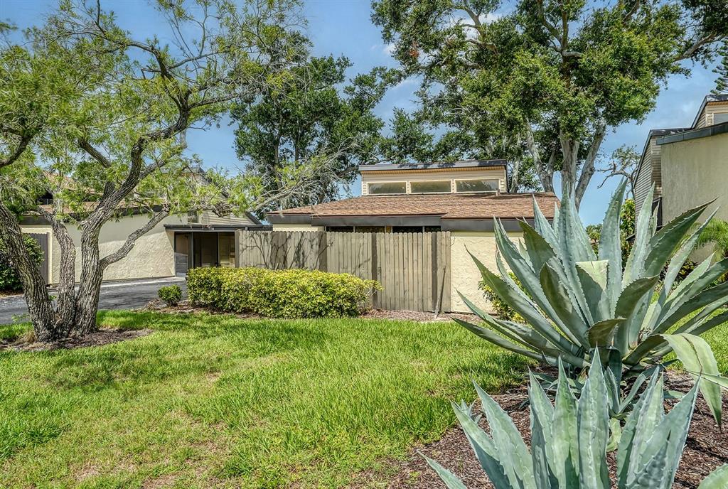 718 White Pine Tree Road, Unit 80 Venice, FL 34285 - Photo 1 of 1 a view of a house with a yard