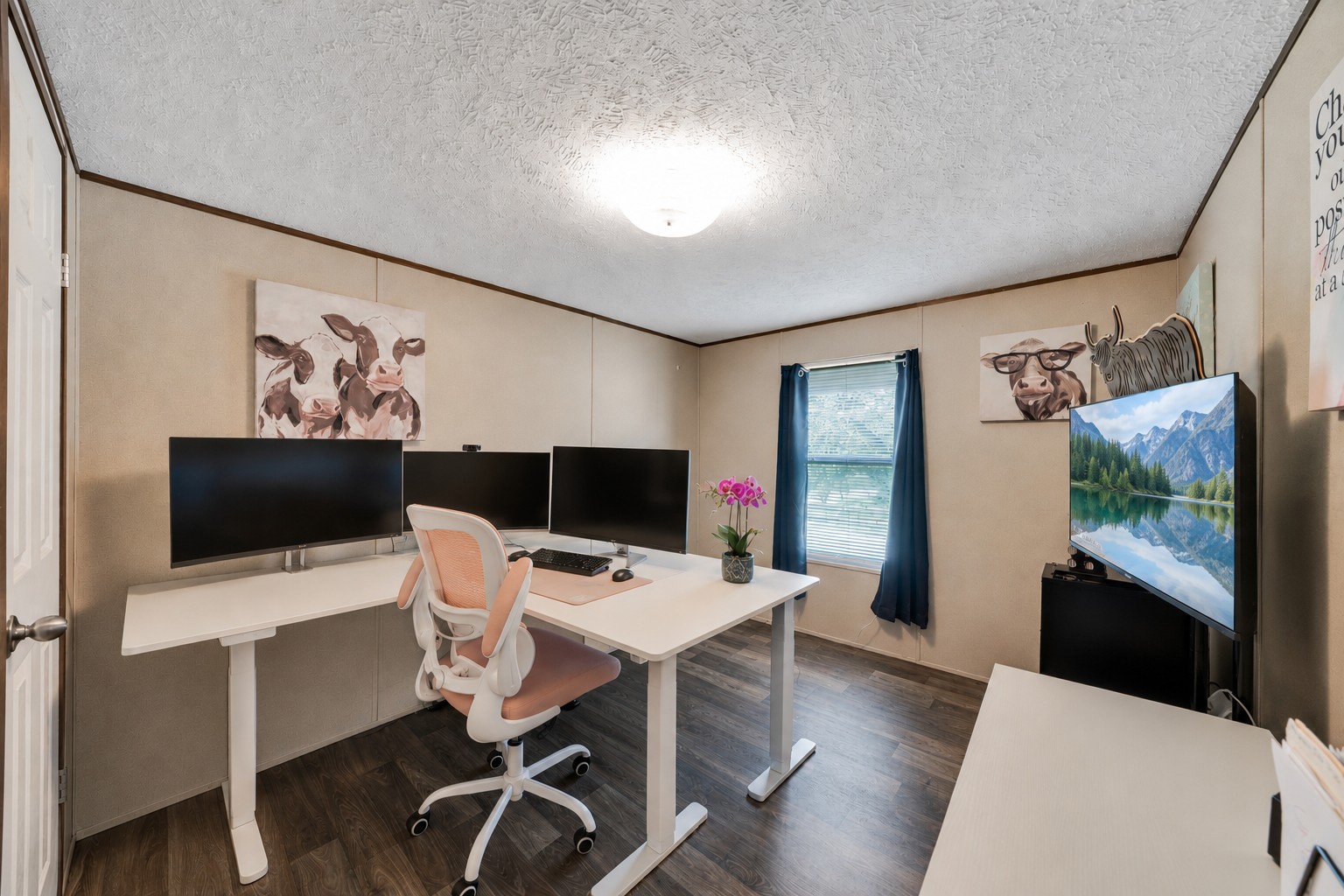 2755 Washburn Road Luling, TX 78648 - Photo 17 of 40 This bedroom is currently used as a functional office space features durable flooring and ample natural light from the window.
