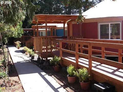 a view of a chairs and a table in the balcony