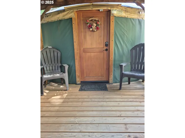 a view of a chair and table in the patio