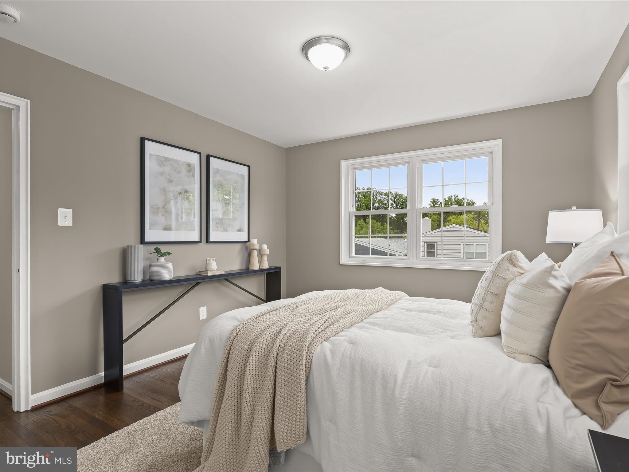 13214 Holdridge Road Silver Spring, MD 20906 - Photo 16 of 33 a bedroom with a bed and window