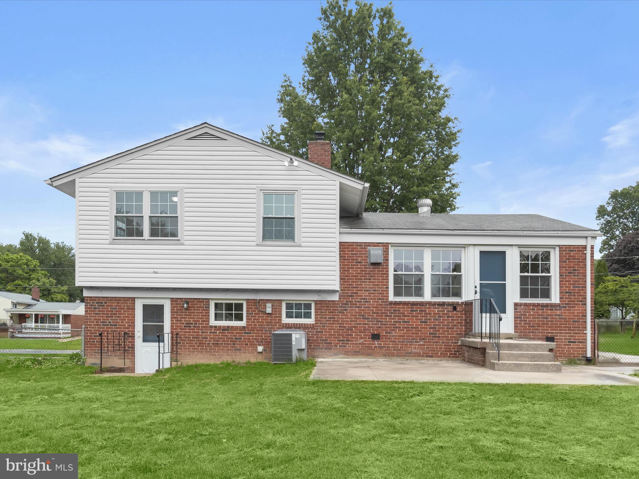 13214 Holdridge Road Silver Spring, MD 20906 - Photo 23 of 33 a front view of a house with a yard and porch