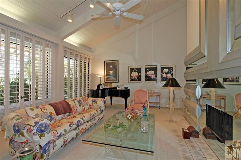 925 Inverness Drive Rancho Mirage, CA 92270 - Photo 11 of 35 a living room with furniture and a fireplace