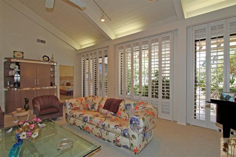 925 Inverness Drive Rancho Mirage, CA 92270 - Photo 12 of 35 a bedroom with furniture and a large window