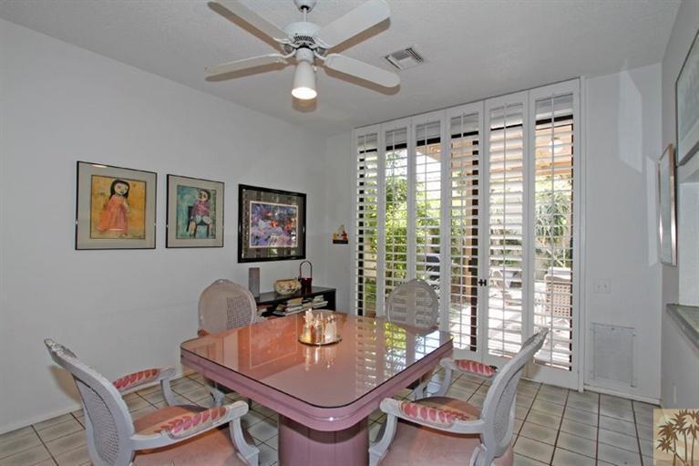 925 Inverness Drive Rancho Mirage, CA 92270 - Photo 15 of 35 a room with furniture and a window