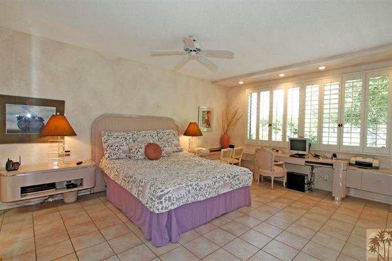 925 Inverness Drive Rancho Mirage, CA 92270 - Photo 16 of 35 a bedroom with a bed and ceiling fan