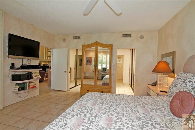 925 Inverness Drive Rancho Mirage, CA 92270 - Photo 18 of 35 a bedroom with a bed and a flat screen tv