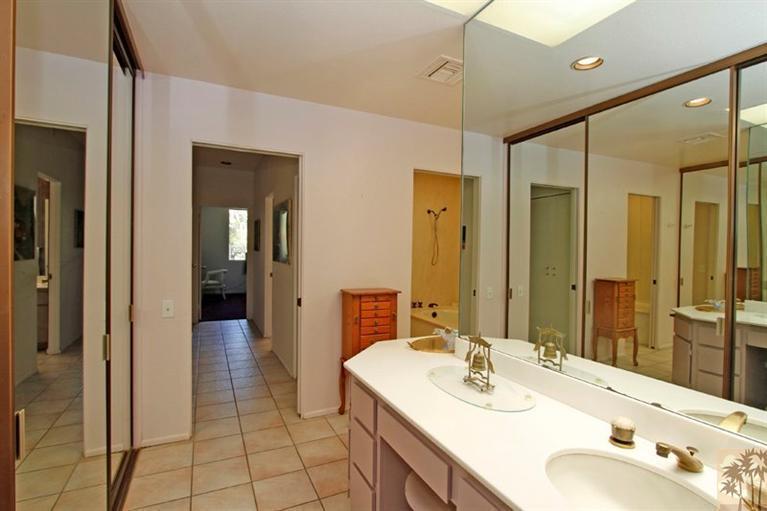 925 Inverness Drive Rancho Mirage, CA 92270 - Photo 19 of 35 a bathroom with a sink vanity granite tub and shower
