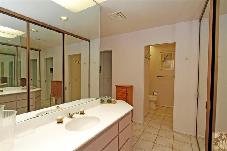 925 Inverness Drive Rancho Mirage, CA 92270 - Photo 20 of 35 a bathroom with a sink and a mirror