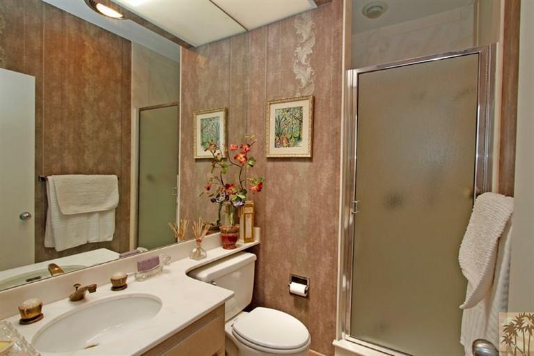 925 Inverness Drive Rancho Mirage, CA 92270 - Photo 22 of 35 a bathroom with a sink toilet and shower